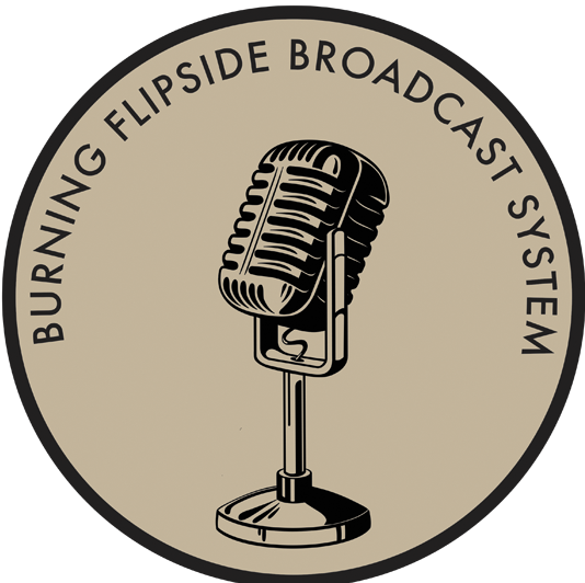 Tan circle with dark brown trim. In the middle is an old fashioned microphone with the words "Burning Flipside Broadcast System" around the top edge